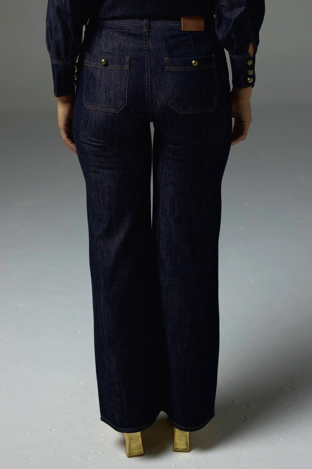 Dark blue jeans on a gray background